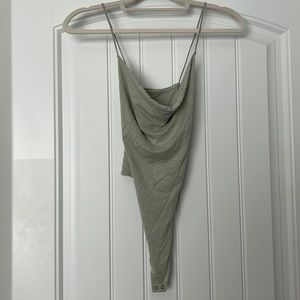 Pale green cow neck body suit with cross back